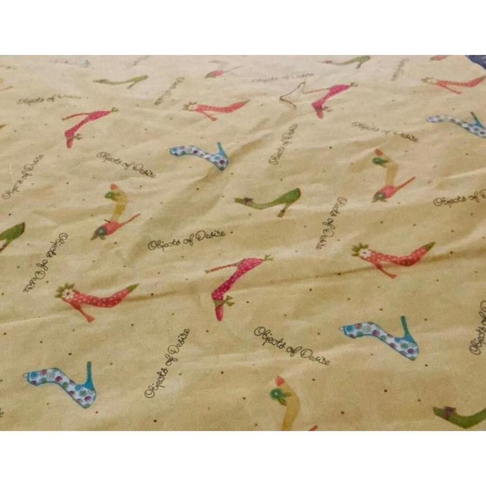 Moda Fabrics Sewing Fabric with Shoe Print Pattern - 1/2 Yard